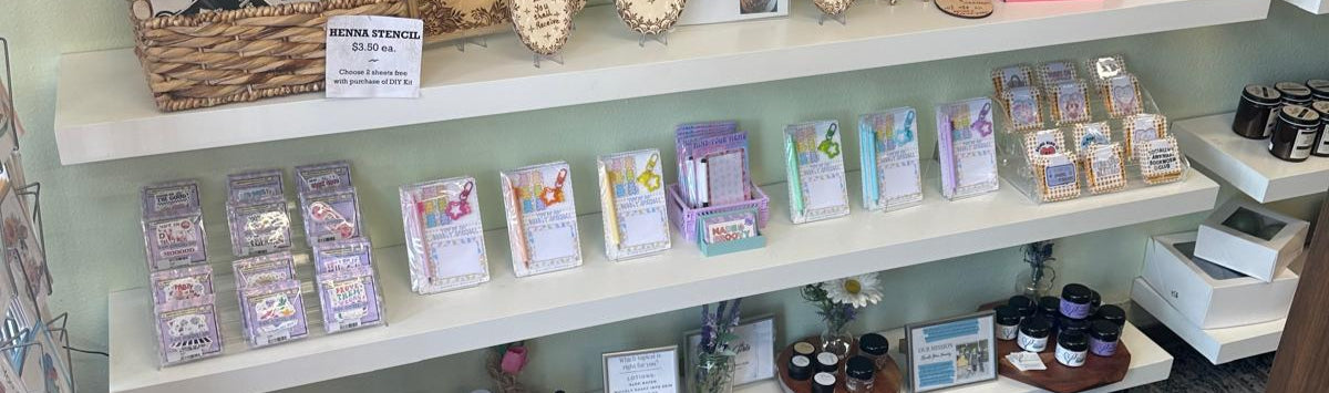 Shelves with various items including photo frames and small products in a store setting.